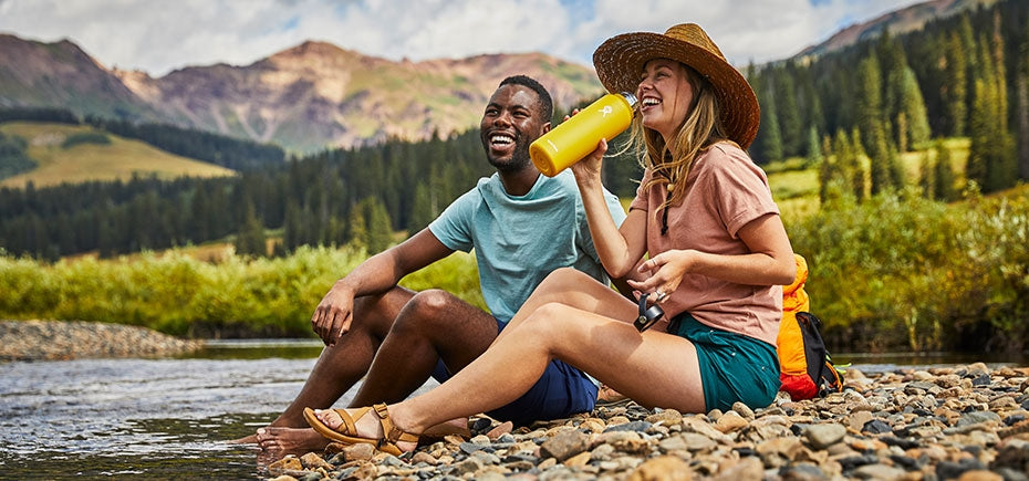 enjoying the outdoors drinking from a hydro flask water bottle Abersoch Wales